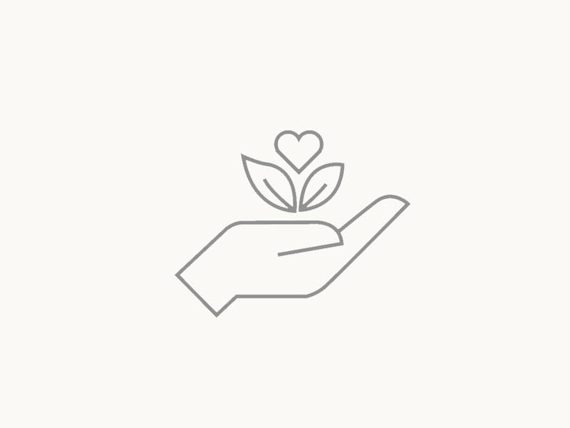 Ein Symbol mit einer Hand, die eine Pflanze hält, symbolisiert Nachhaltigkeit